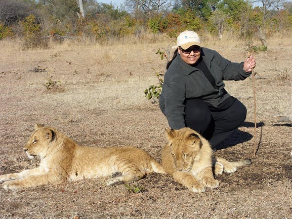 Nazlee Ally - on a lion walk at Vic Falls